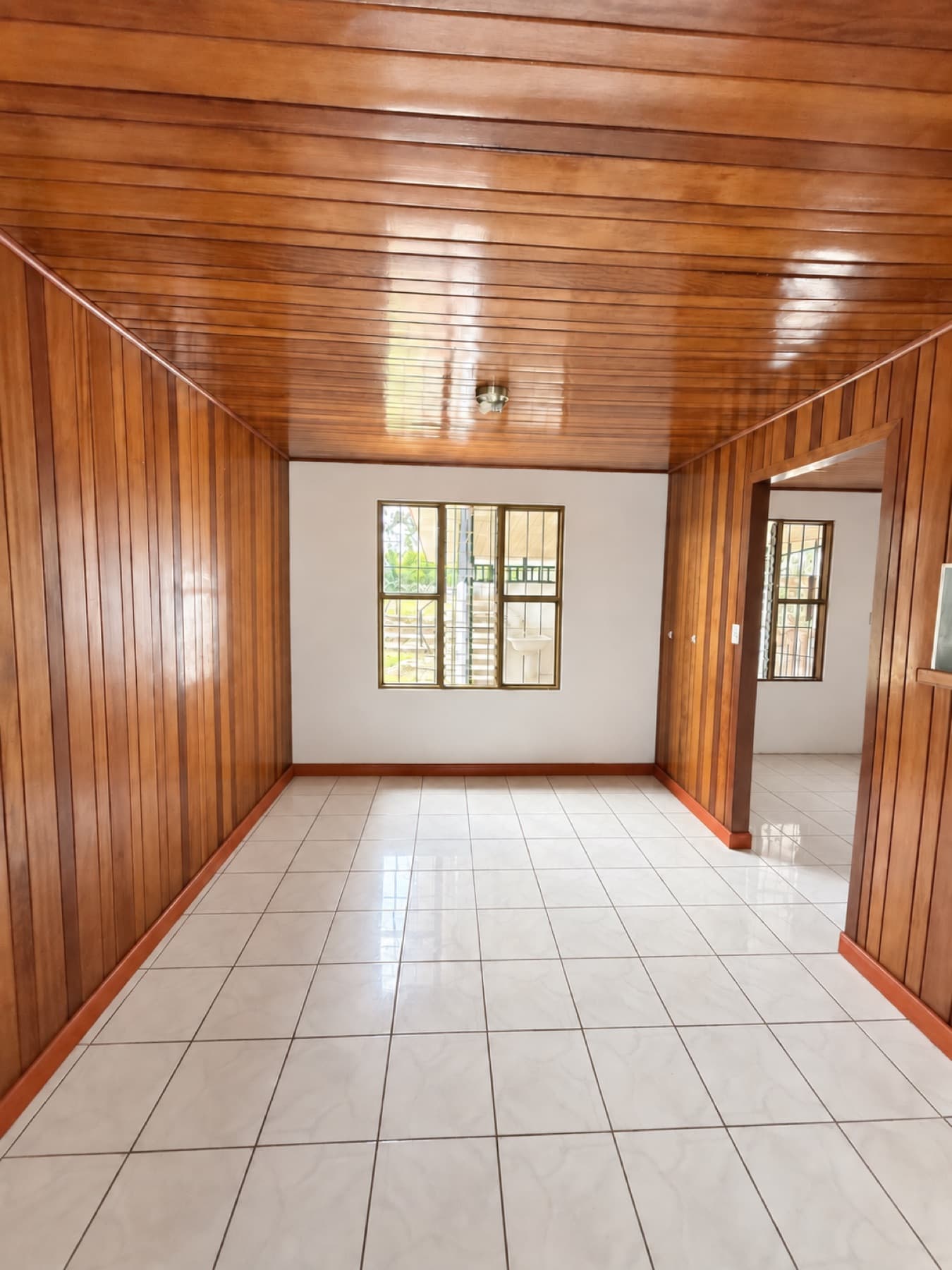 Wide hallway with wood ceiling